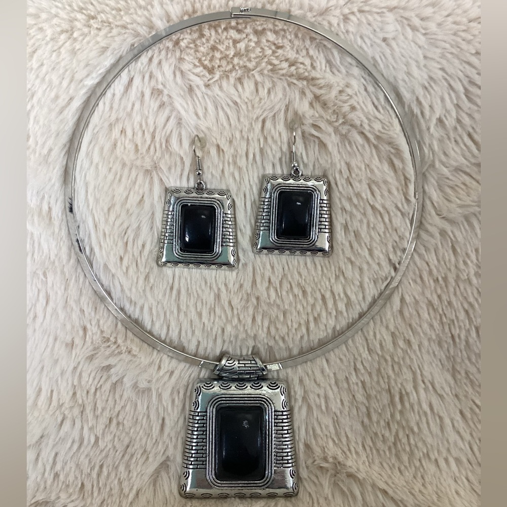 Silver and black earring and necklace set.